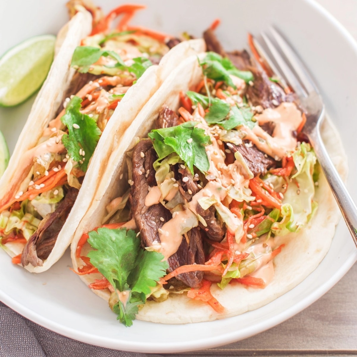 Korean BBQ Beef Tacos with Kimchi: Smoky beef, colorful veggies erupt from warm tortillas.