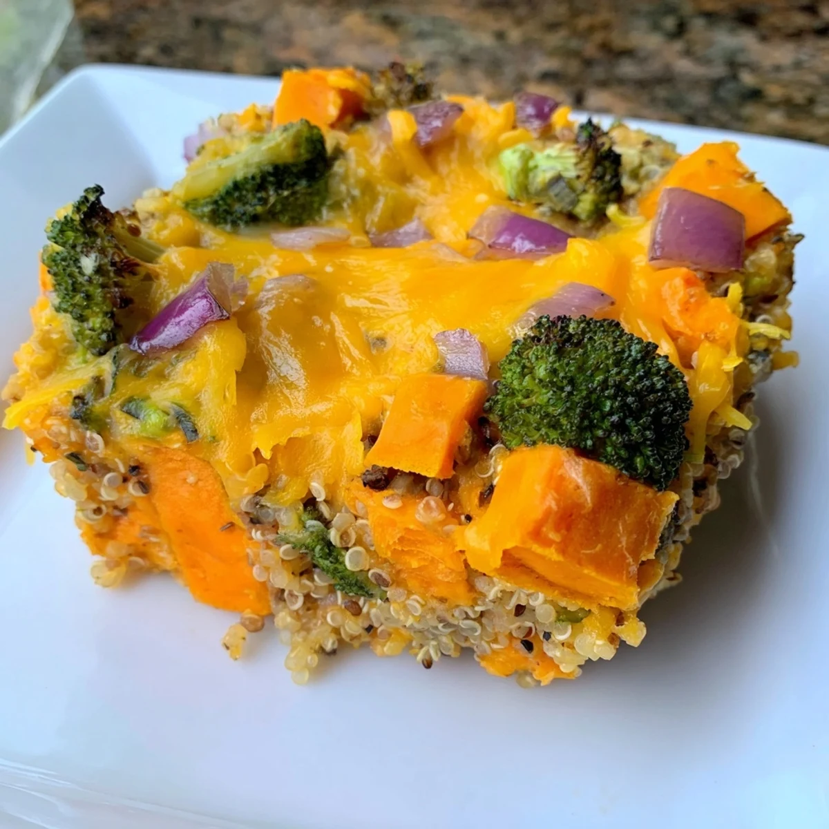 A golden-brown Goodness Baked casserole, bubbly and cheesy, bursting with colorful, roasted vegetables.