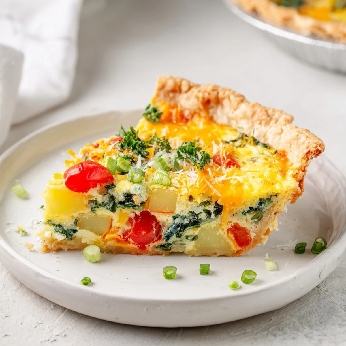 A warm, flaky crust holds a rich filling of the flavorful Savory Bacon-Free Egg Pie, perfect for brunch.