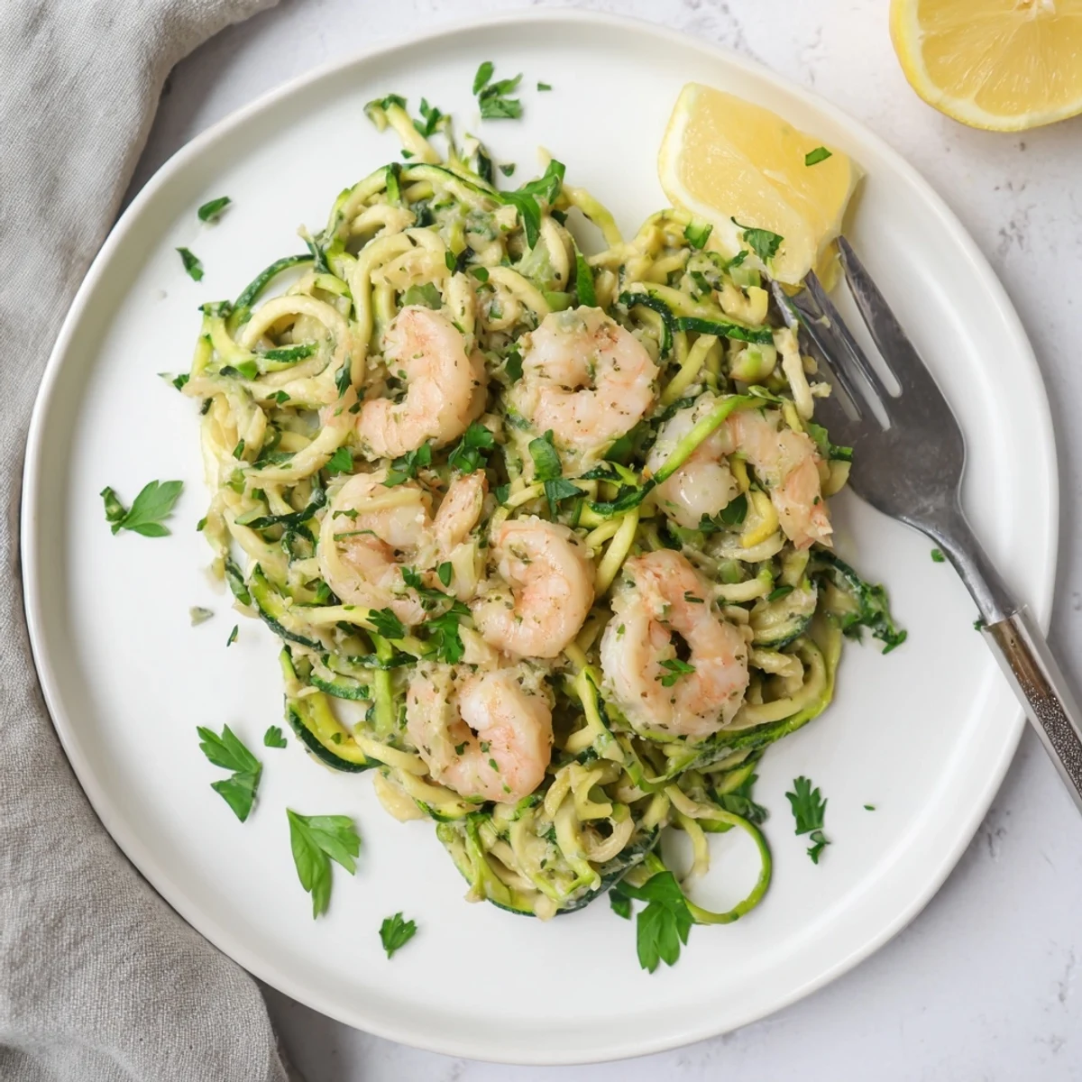 Plate of Creamy Garlic Shrimp with Zucchini Noodles featuring plump shrimp in a rich, velvety sauce.  