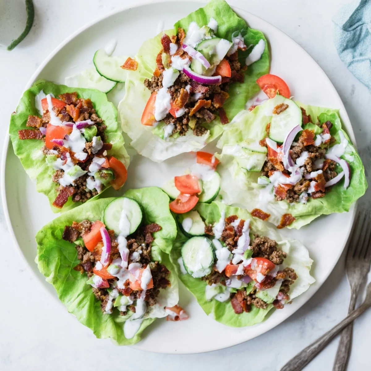 Golden chicken, seasoned beef, and crispy bacon piled in crisp lettuce cups drizzled with creamy ranch dressing