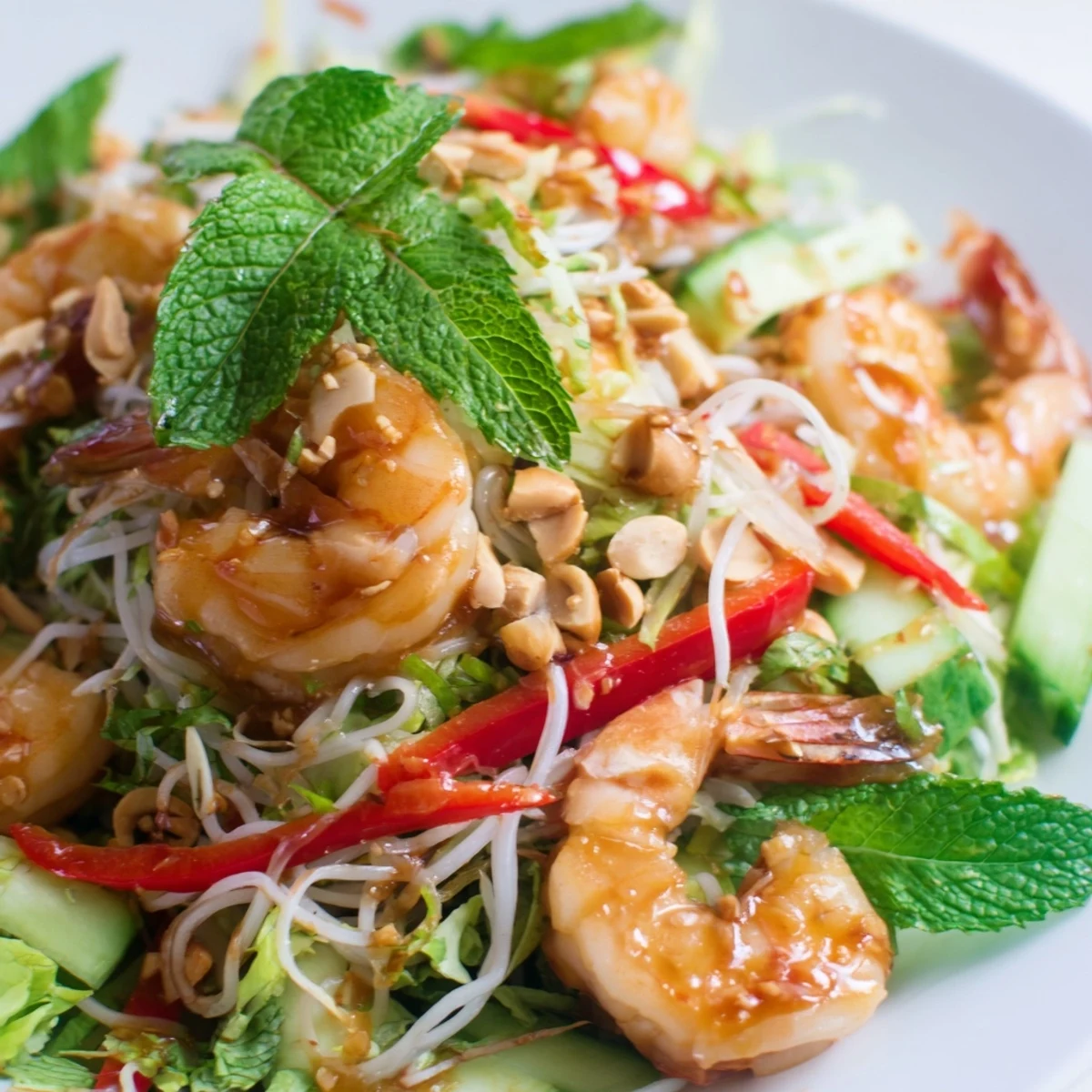 Fresh Spring Roll Salad with Spicy Ginger Dressing topped with crunchy peanuts and fragrant herbs