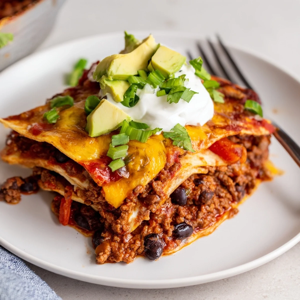Beef Skillet Enchiladas bubbling with melted cheese and fresh cilantro