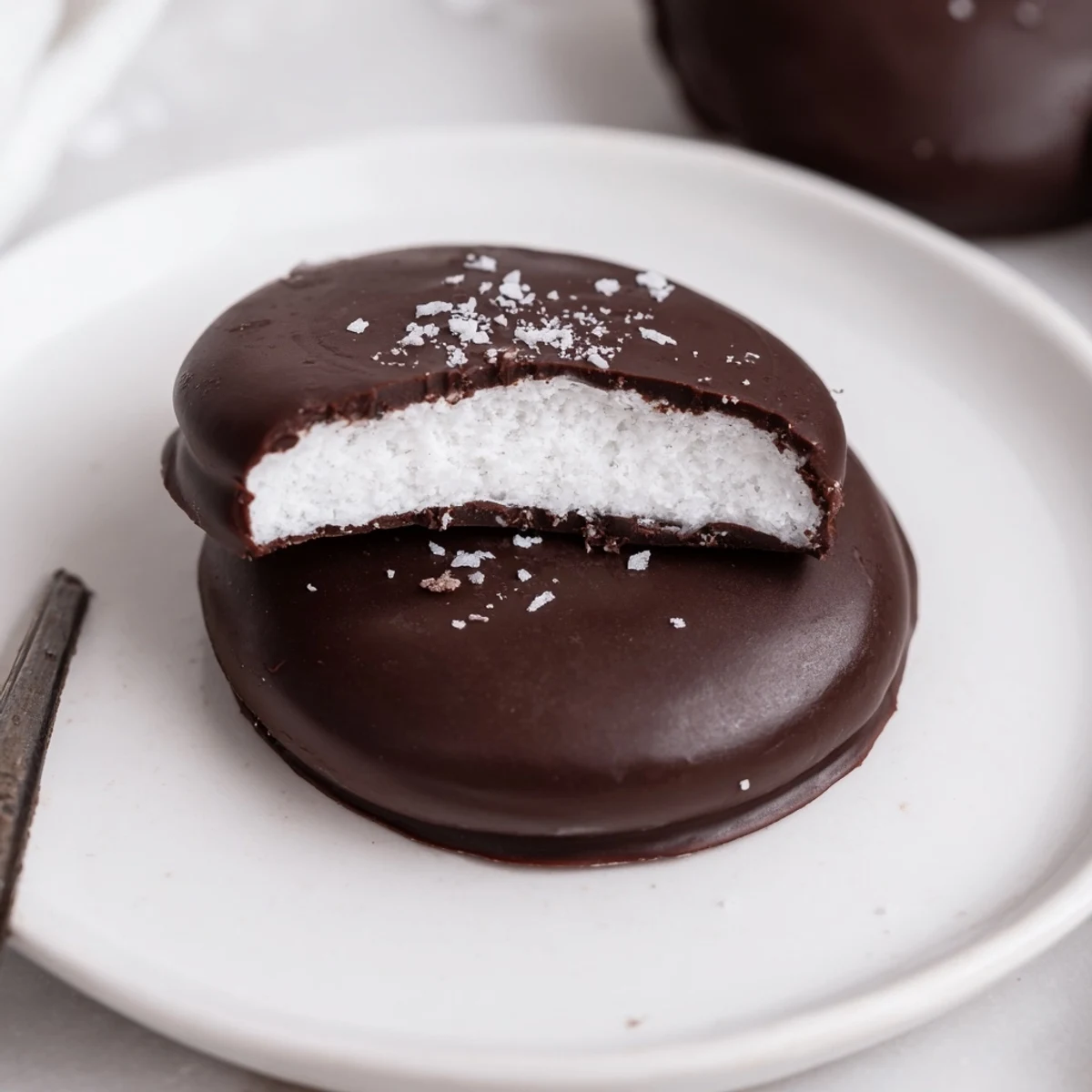 Homemade Peppermint Patties chilled on a tray, mint aroma and snap